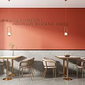 Modern Dining Table Set With Metal Frame Chairs And Pendant Lights On Coral Wall
