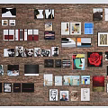 Brick Wall Decorated With Various Photos Artworks And Decorative Items