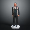Man In Black Suit With Flower Garland Standing On White Pedestal