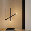 Modern Black Cross Design Pendant Light in Interior with Wooden Wall and Stack of Books