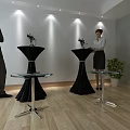 Indoor Interior Scene With People High Glass Top Tables Black Decor And Plants Lighting