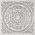 Intricate Circular Carving with Central Floral Motif and Elaborate Patterns