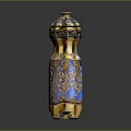 Elegant Ornamental Bottle Design With Blue And Gold Enamel Finish Intricate Patterns And Decorative Lid