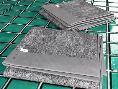 Folded Grey Textured Towels Displayed on Green Tile Floor Surface 3d model