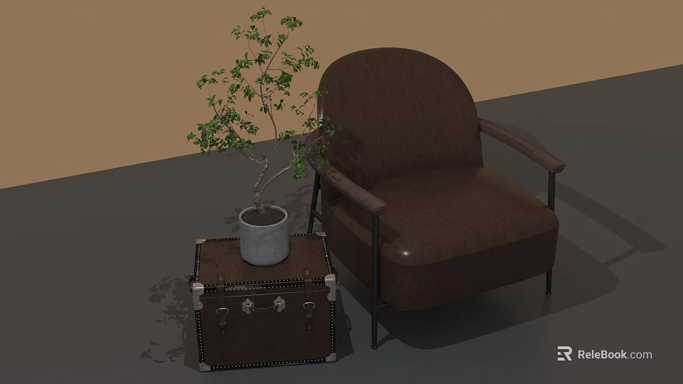 Brown Leather Armchair With Leather Trunk Side Table And Potted Plant 3d model 