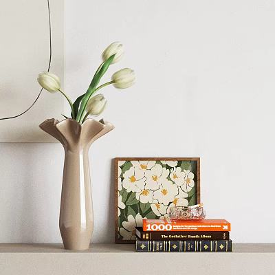 Beige Pleated Vase With White Tulips And Framed Floral Artwork On Stack Of Orange Books 3d model