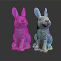 Two Turquoise Decorative Sitting Rabbit Statues on Dark Reflective Surface