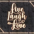 Illuminated Lighting Combination With Live Laugh Love Text And Strip Lights On Dark Stone Wall