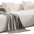 Modern Sectional Sofa Set With Grey White Upholstery Pillows Blankets And Ottoman