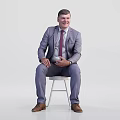 Businessman In Gray Suit Red Tie Sitting On White Stool Holding Coffee Cup