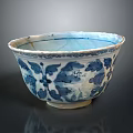 Carved Ceramic Bowl With Blue And White Floral Patterns And Intricate Details