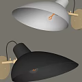White and Black Wall Lamps With Gold Bases Funnel Shaped Shades And Lit Bulbs