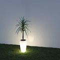 Outdoor Light Illuminating White Flower Pot With Green Plant On Grass And White Wall Background