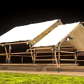 Outdoor Canopy With Wooden Frame White Canvas Roof And String Lights On Grassy Platform