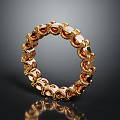Elegant Golden Circular Bracelet Adorned With Red Gemstones And Intricate Design