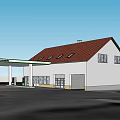 White Gas Station Building With Red Roof Fuel Pumps And ExxonMobil Canopy