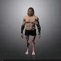 Muscular Shirtless Man in Black Shorts with Arm Wraps Barefoot Standing Against Gray Background