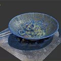 Yellow Noodles with Squid and Tomatoes in Textured Bowl and Chopsticks on Side