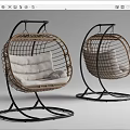 Two Modern Rattan Swing Chairs With White Cushions And Black Metal Frames