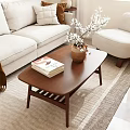 Brown Wooden Coffee Table With Stacked Books And Vase In Modern Beige Sofa Living Room