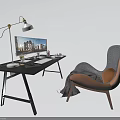 Modern Office Desk With Desk Lamp Computer Monitor And Cozy Accent Chair
