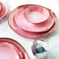Elegant Dining Table Setting With Pink Gradient Plates Gold Rim And Marble Tabletop