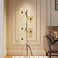 Modern Floor Lamp With Irregular Panels And Metal Stand Next To Leather Sofa