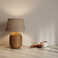 Ceramic Base Table Lamp With Fabric Lampshade And White Tray Coffee Cup Cookies On Table