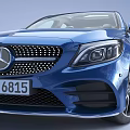 Blue Mercedes Sedan With Sporty Design Signature Grille And Alloy Wheels