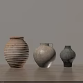 Ceramic Vessels On Wooden Table With Textured Surfaces And Neutral Background