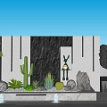 Garden Feature Wall With Cactus Rabbit Sculpture Stones And Fountain Plants