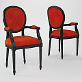 Elegant classic style armchairs with red velvet upholstered seats and black wooden frames