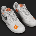 White Low Top Sneakers Featuring Orange Patches Black Designs And Gray Laces