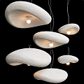 Textured White Cloud-shaped Modern Pendant Lights Hanging with Warm Glow in Contemporary Space