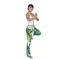 Woman Doing Tree Yoga Pose In White Tank Top And Tropical Leaf Print Leggings