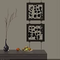 Abstract Paintings in Black Frames with Leaf Patterns by Vase and Fruit on Light Wall 3d model