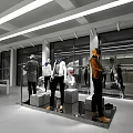 Modern Clothing Store Interior With Mannequins Displaying Stylish Outfits On Concrete Platforms And Bright Lighting