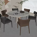 Modern Round Dining Table with Leather Chairs in Bright Interior with Plants and Artwork