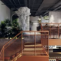 Modern Steak Restaurant Interior With Mezzanine Floor Metal Railings Gray Walls And Lighting