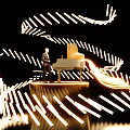 Man Standing By Piano Surrounded By Golden Light Strips On Black Background