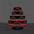 Elegant Tiered Black Cake With Red Decorations And Wavy Edges On Display Stand