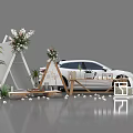 Outdoor Stylish Setup With White Car Triangular Tent Floral Decor And Green Plants