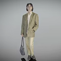 Woman in Plaid Blazer White Shirt Beige Pants Holding Gray Handbag Standing Against Gray Background