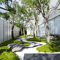 Beautiful Park Landscape With Green Trees Winding Path Grass Stones White Walls And Glass Building