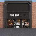 Exterior View Of The Coffee Hotel With Red Brick Wall Black Signage And Glass Doors