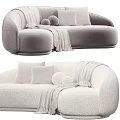 Modern Cream Sectional Sofa With Soft Throw Blanket And Round Decorative Pillows