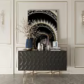 Black Scalloped Console Sideboard Gold Legs Decorated With Vase Books Candles On White Wall Artwork