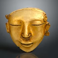Ancient Golden Mask With Smiling Expression Intricate Facial Features And Decorative Ears