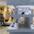 Elegant Chanel Fashion Store Interior Featuring Model Posters Display Counters And Accessories