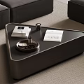 Modern Minimalist Dark Triangular Coffee Table With Books And Aromatherapy Decor In Cozy Living Room